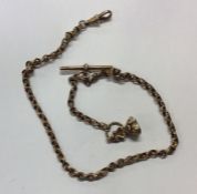 A 9 carat fancy link chain together with a seal. A