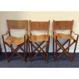 A set of four suede seated director's chairs by Ni