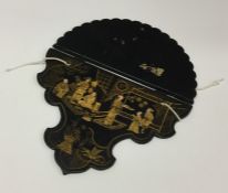 A Japanese lacquer wall bracket decorated with fig