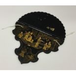 A Japanese lacquer wall bracket decorated with fig