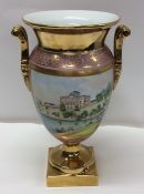 A flamboyant vase decorated in gold on square base