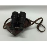 A good pair of cased binoculars. By Carpenter of L