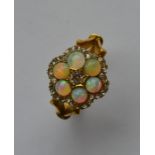 A large Edwardian opal and diamond circular cluste