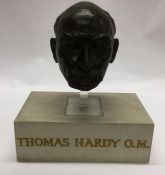 A large bust depicting Thomas Hardy mounted upon s