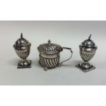 A silver three piece cruet on ball feet. Approx. 1