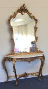 An ornate gilt consul table with overmantle mirror