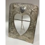An Indian silver heart shaped picture frame decora