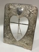 An Indian silver heart shaped picture frame decora