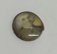 An oval gold mounted miniature of a gentleman in t