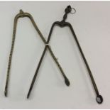 Two pairs of 18th Century brass ember tongs. Est.