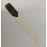 A Continental silver and ivory paper knife decorat