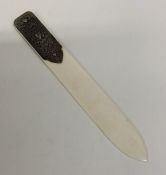 A Continental silver and ivory paper knife decorat