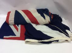 An old Union flag together with two others. Est. £