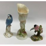 A Royal Worcester figure of a budgie together with