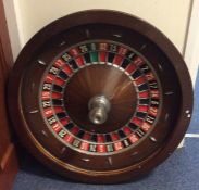 A large mahogany and slate bagatelle game. Est. £5