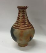 A baluster shaped pottery vase with geometric desi