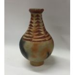 A baluster shaped pottery vase with geometric desi