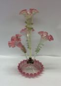 A tall cranberry glass trumpet epergne with wavy e