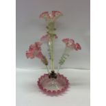 A tall cranberry glass trumpet epergne with wavy e