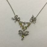 An attractive Victorian demantoid garnet and diamo