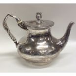 A Victorian silver teapot attractively decorated w