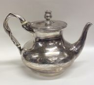 A Victorian silver teapot attractively decorated w