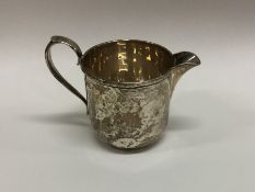 An Edwardian silver cream jug. Sheffield. By GW. A