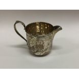 An Edwardian silver cream jug. Sheffield. By GW. A