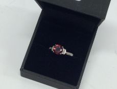 A diamond mounted ring in white gold claw mount. A