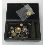 A box containing brooches, ear clips etc. Est. £10