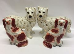 Two pairs of Staffordshire dogs. Est. £20 - £30.