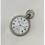 A silver open faced pocket watch with white enamel