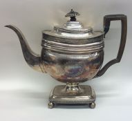 A tall Georgian silver coffee pot on pedestal base