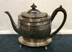 A good Georgian silver bright cut teapot on stand