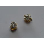 A pair of large diamond single stones mounted as e