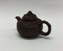 A Chinese terracotta small teapot with lift-off co