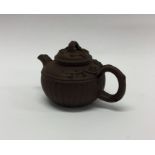 A Chinese terracotta small teapot with lift-off co