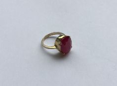 A large oval ruby single stone ring in 18 carat cl