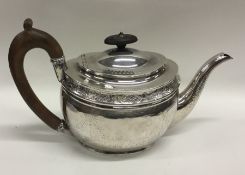 A Georgian silver bright cut oval teapot. London.