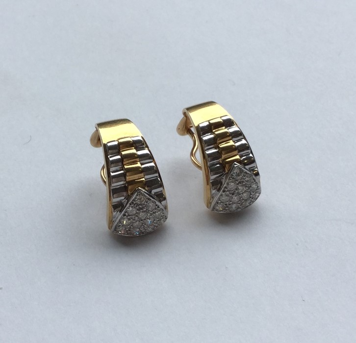 A pair of unusual two colour 18 carat gold earring