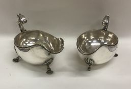 A pair of silver plated Georgian style sauce boats