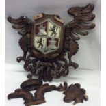 A large Continental oak crest decorated with eagle