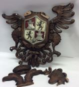 A large Continental oak crest decorated with eagle