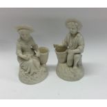 A pair of 20th Century decorative parian figures.