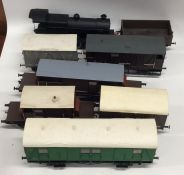 A collection of '0' gauge locomotives and rolling