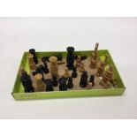 An ebony chess set of turned form. Est. £20 - £30.