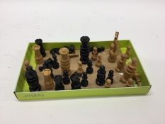 An ebony chess set of turned form. Est. £20 - £30.