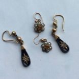 A pair of onyx and gold mounted drop earrings toge