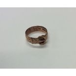 A 9 carat buckle ring. Approx. 4.6 grams. Est. £45