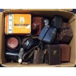 A large box of cameras and other camera equipment,
